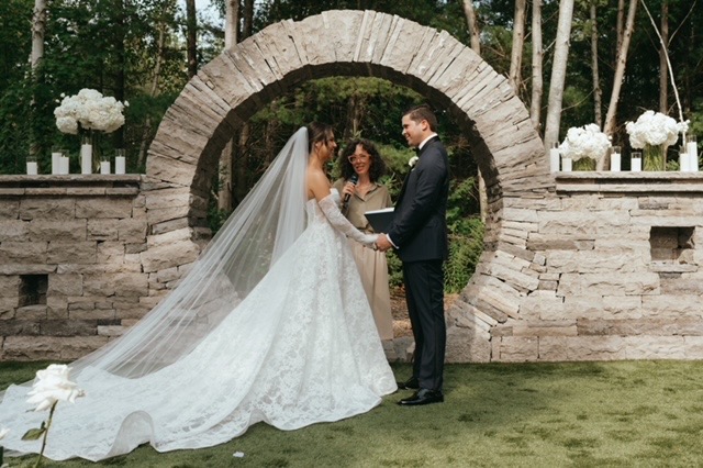 Charity sharing a joyful moment with a wedding couple