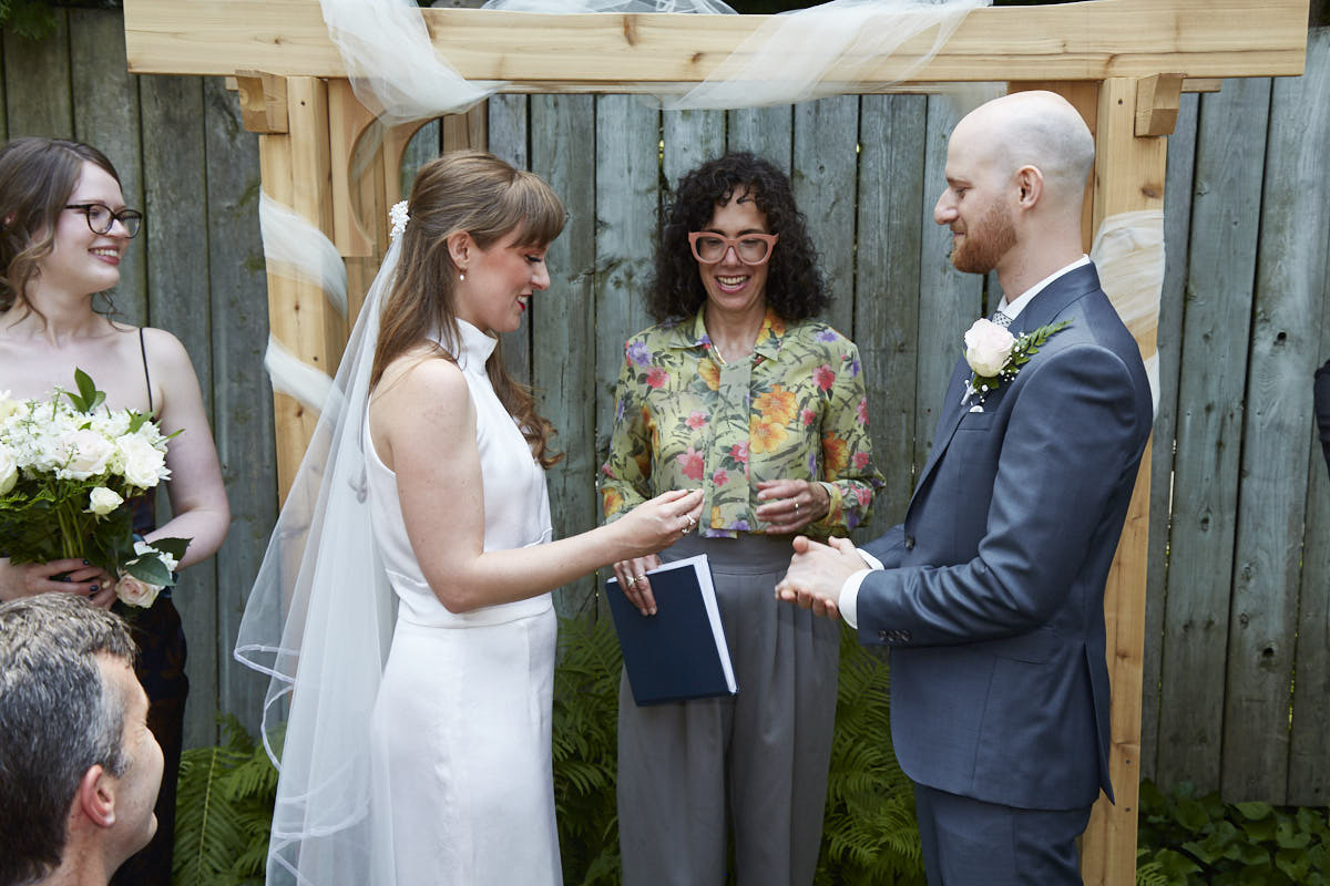 A couple during their wedding ceremony with Charity