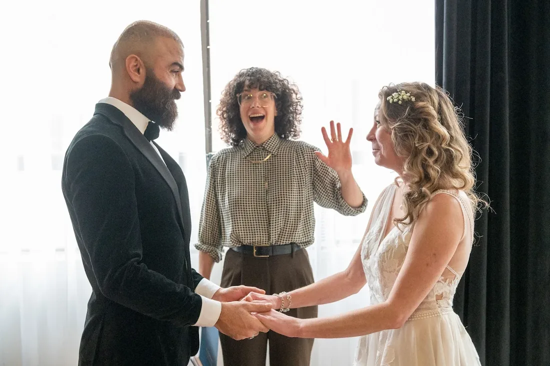 Charity celebrating as a couple shows off their rings